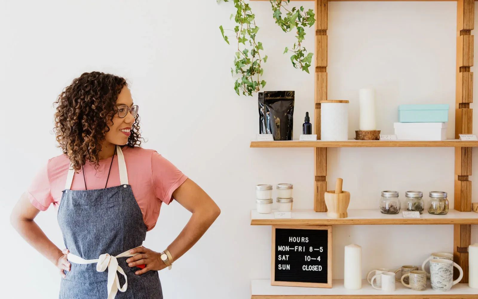A shop owner among the racks in her own store.